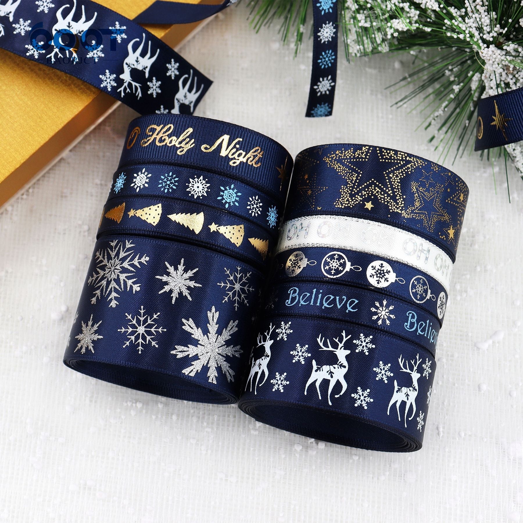 Navy Christmas ribbon with printed “Holy Night” and “Believe” text, gold and snowflake motifs