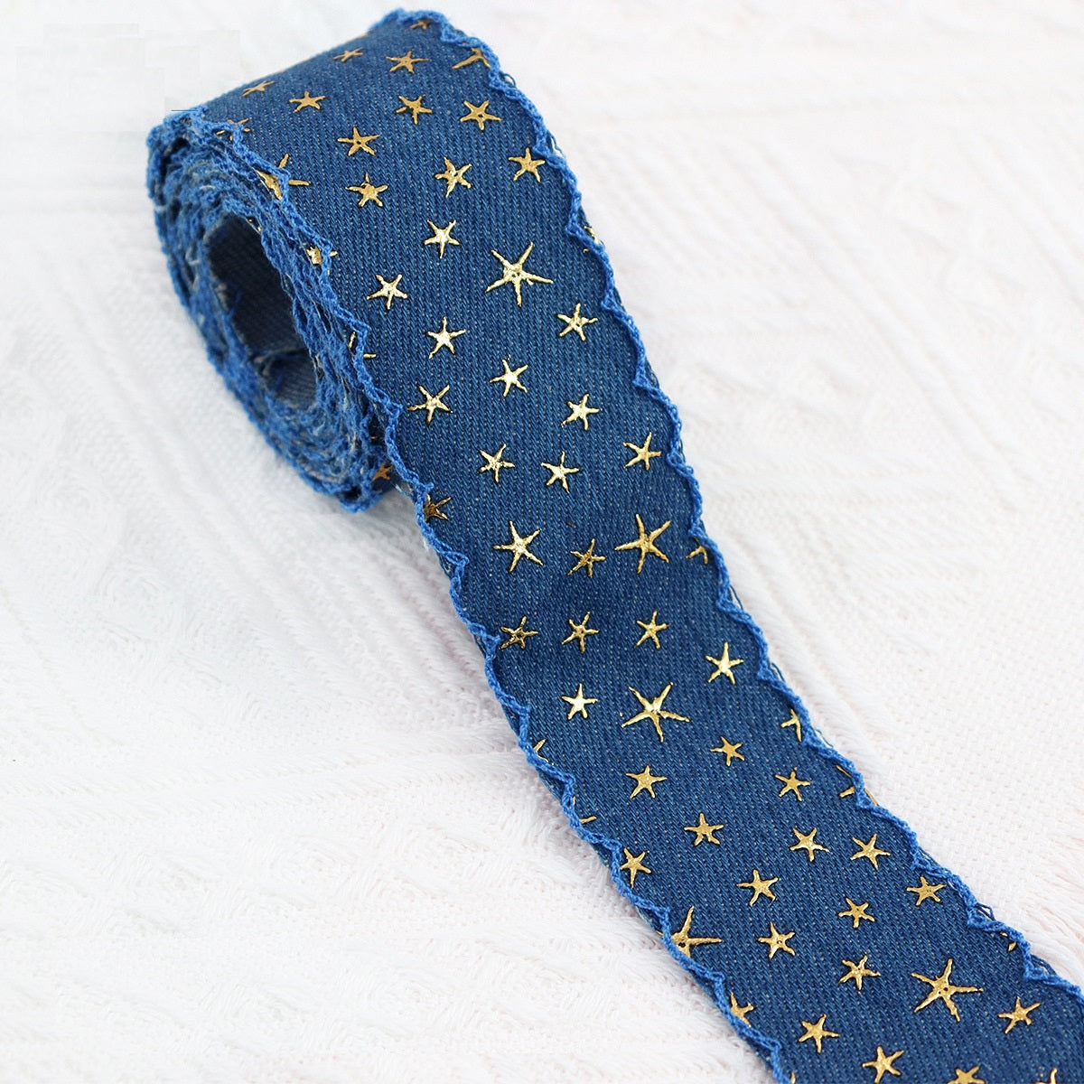 Vintage denim star embroidered ribbon roll, medium blue denim with gold stars