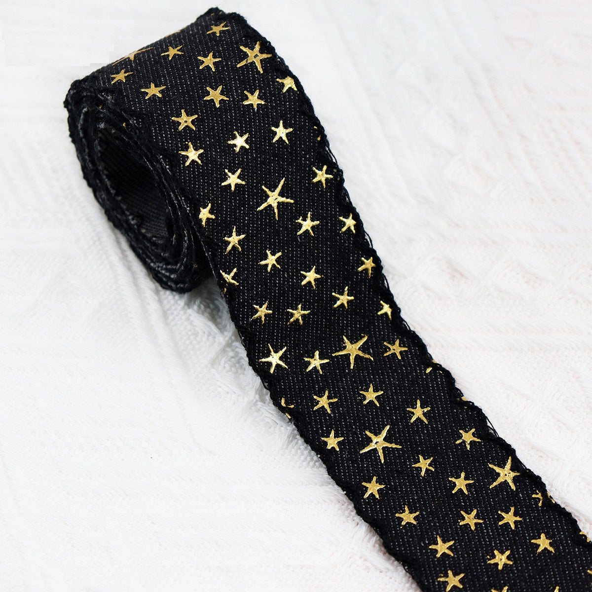 Vintage denim star embroidered ribbon roll, deep black denim with gold stars