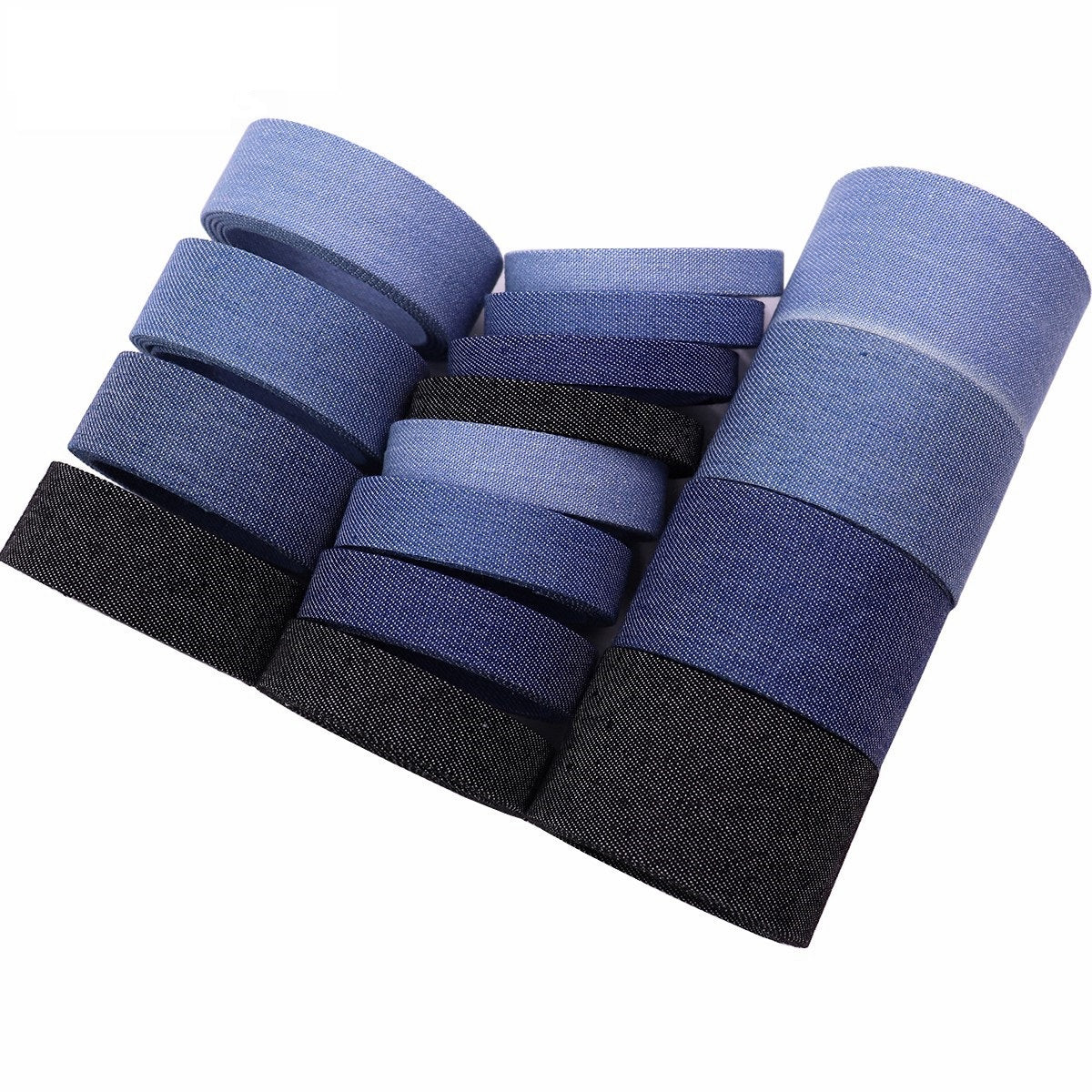 Denim edge binding ribbon rolls stacked in light blue, medium/dark blue, and black
