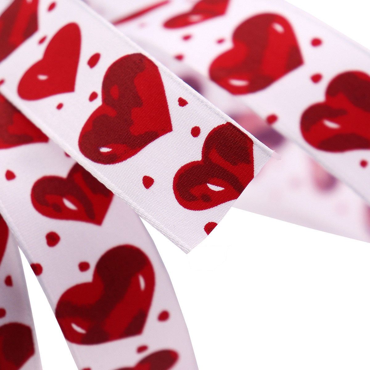 Red heart pattern hot stamping ribbon on white, with glossy printed hearts