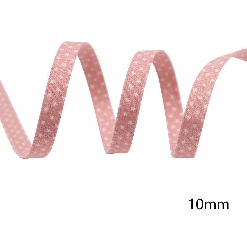 10mm wide star-printed fabric ribbon, light pink with small white star pattern