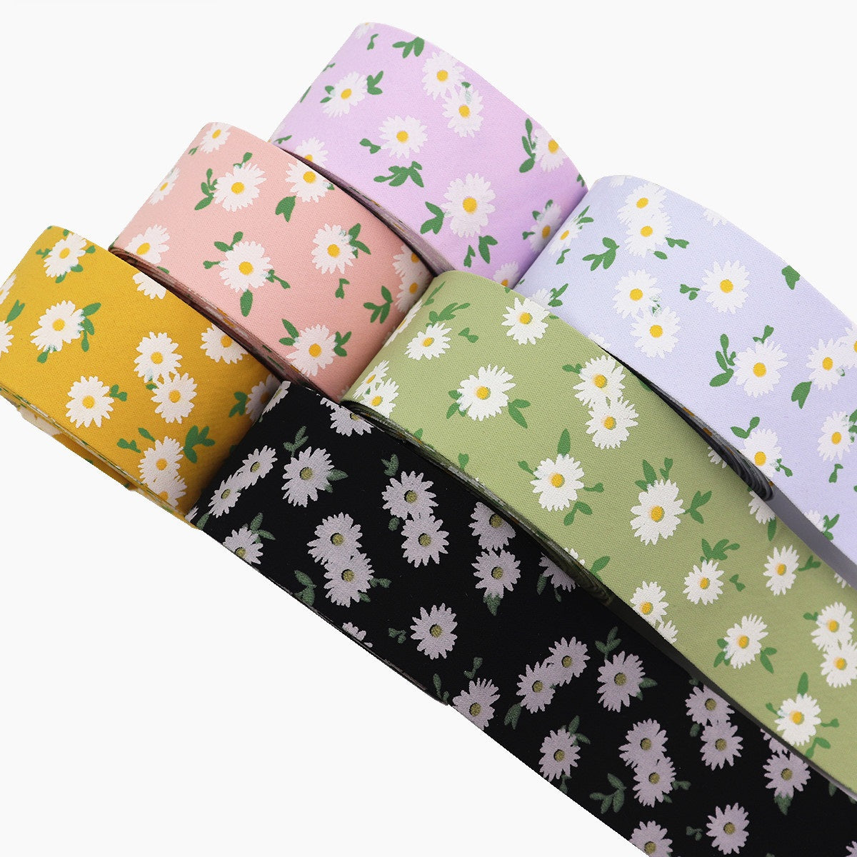 Blumenmuster-Stoffband in Gelb, Schwarz, Olivgrün und Lavendel, ausgerollte Streifen