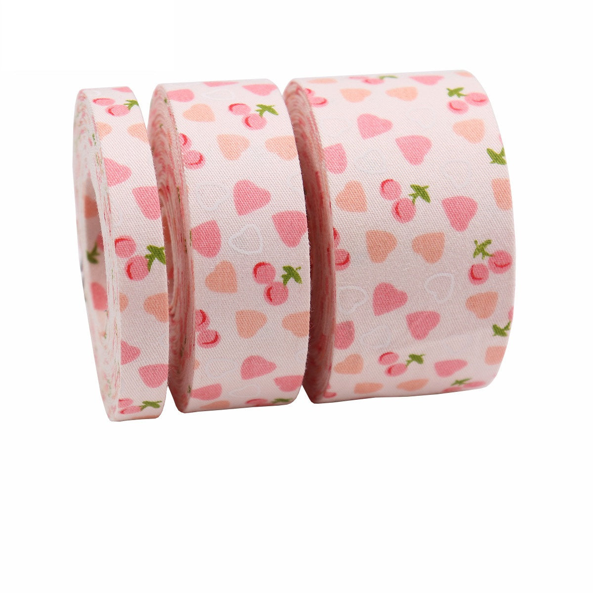 Pink cherry and heart printed bias tape ribbon roll, layered with two matching widths
