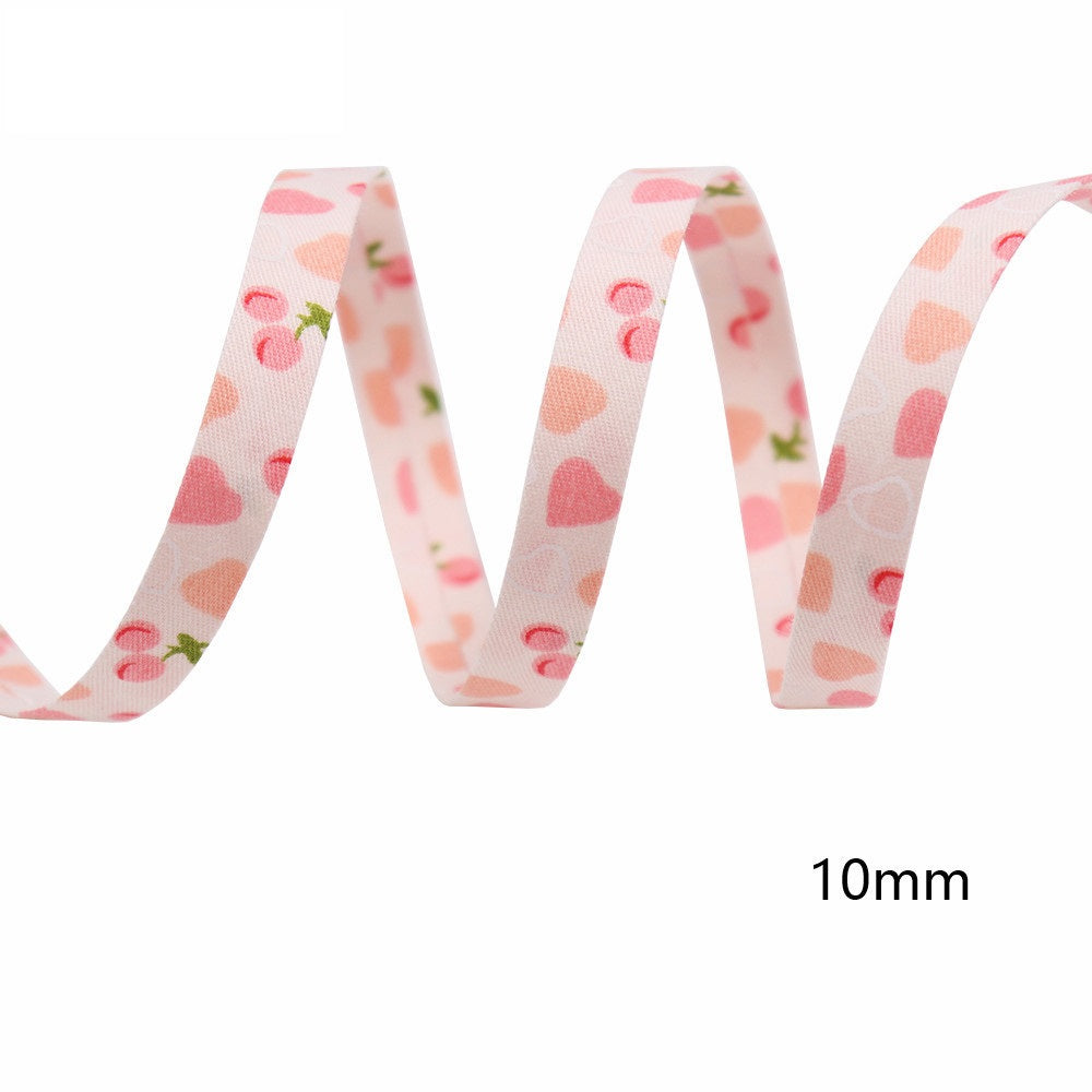 10mm pink cherry and heart bias tape ribbon, single length shown