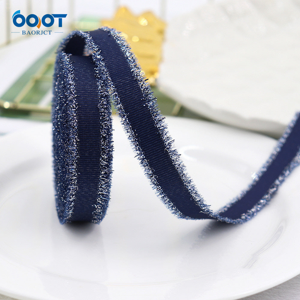 Ribbed metallic ribbon, dark blue roll with sparkly silver edge, narrow width