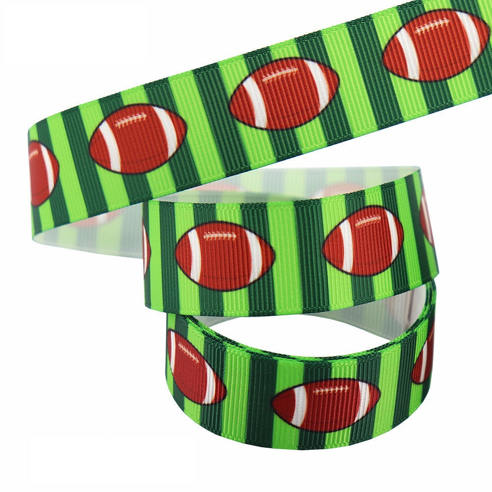 22 mm green ribbon with footballs on vertical stripes, looped webbing