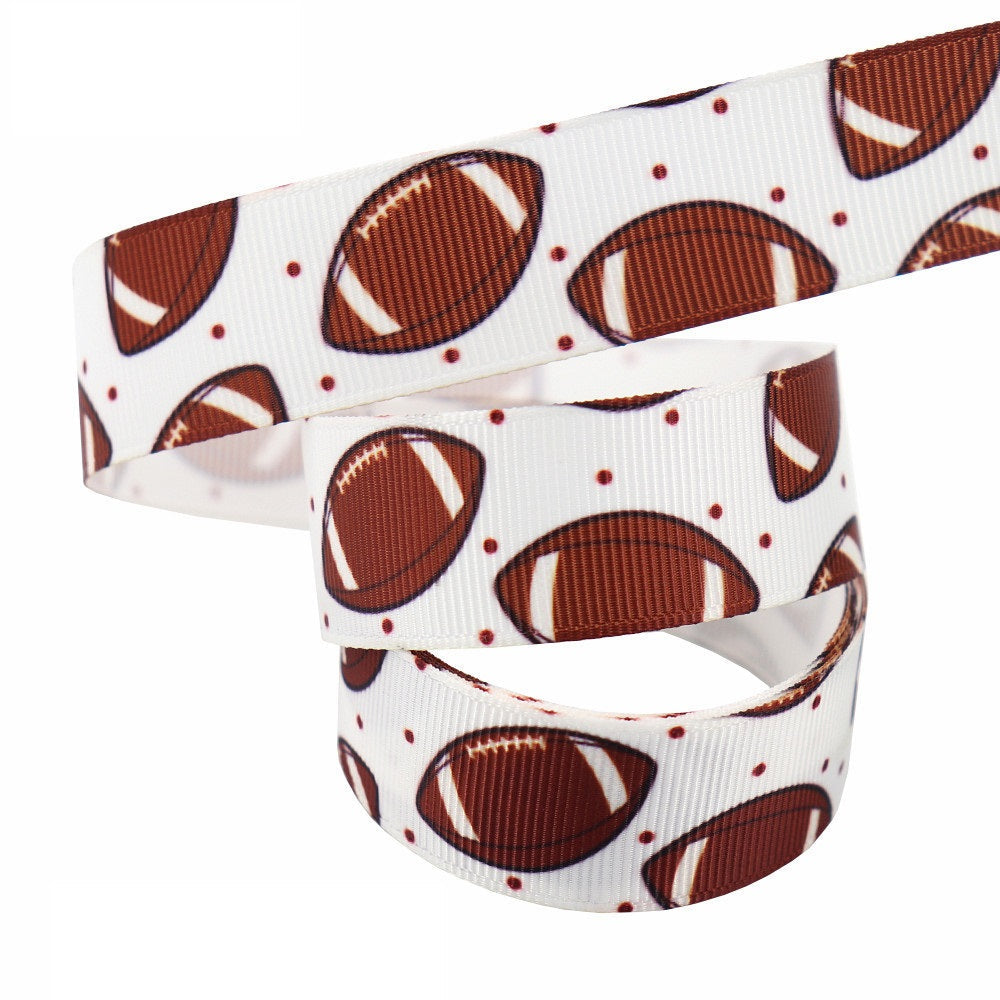 22 mm white football ribbon webbing with brown footballs and small dots, looped