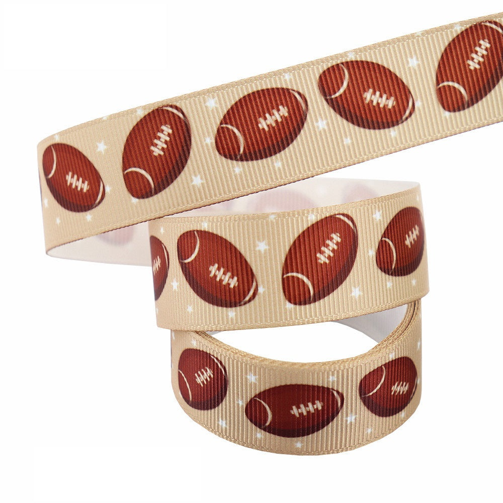 22 mm beige ribbon webbing with red-brown footballs and small star accents