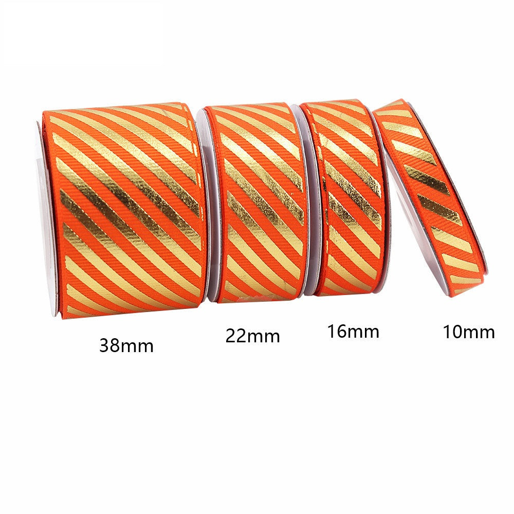 Orange-and-gold diagonal stripe grosgrain ribbon with foil accent, widths 10/16/22/38mm