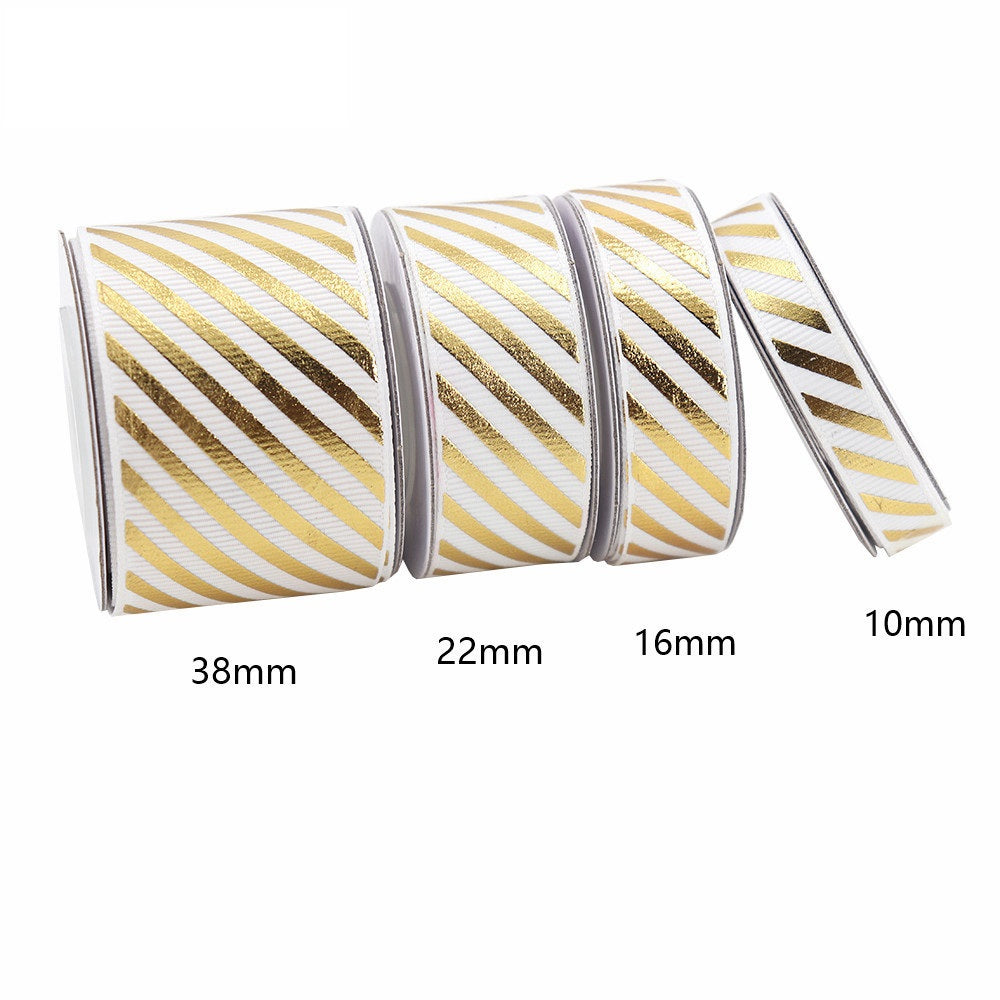 White-and-gold diagonal stripe grosgrain ribbon with foil accent, widths 10/16/22/38mm