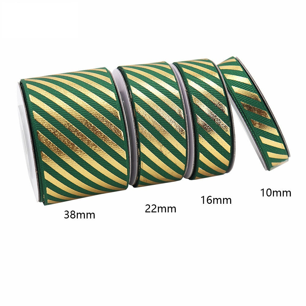 Dark green-and-gold diagonal stripe grosgrain ribbon with foil accent, widths 10/16/22/38mm