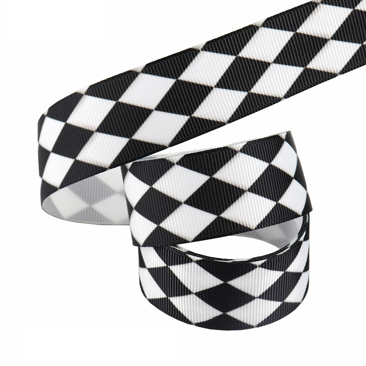 Black-and-white 25mm ribbon coil; diagonal checker pattern heat-transfer tape roll.