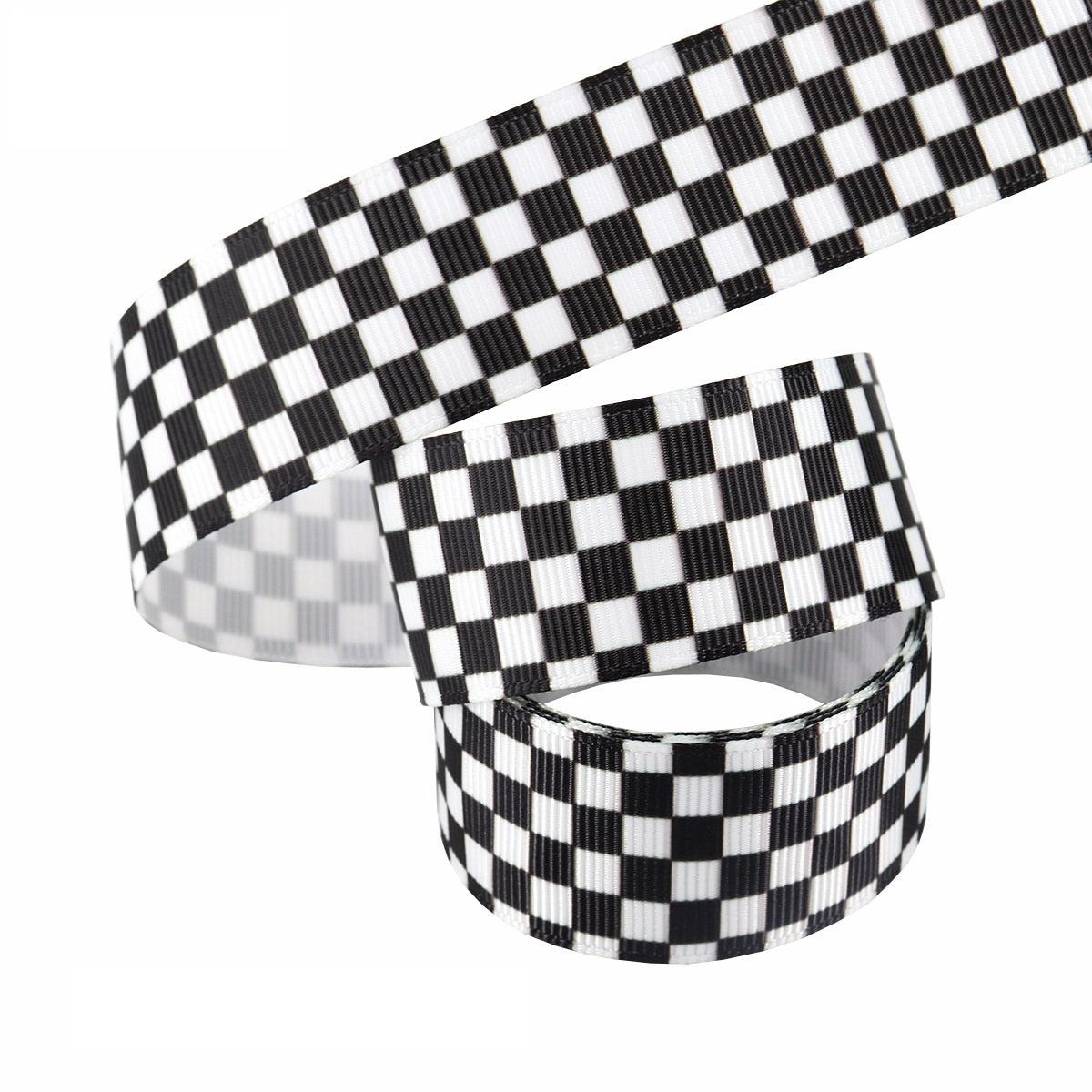 Black-and-white 25mm heat-transfer ribbon roll; stacked stripes and small checker grid pattern.