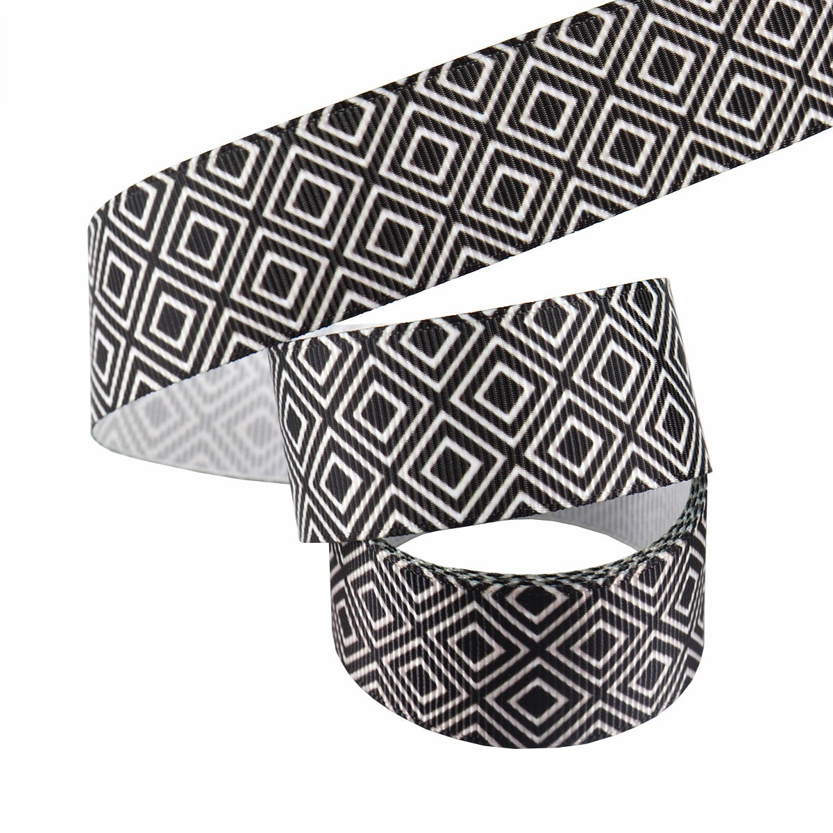 Black-and-white 25mm heat-transfer ribbon; geometric diamond and crosshatch pattern roll.