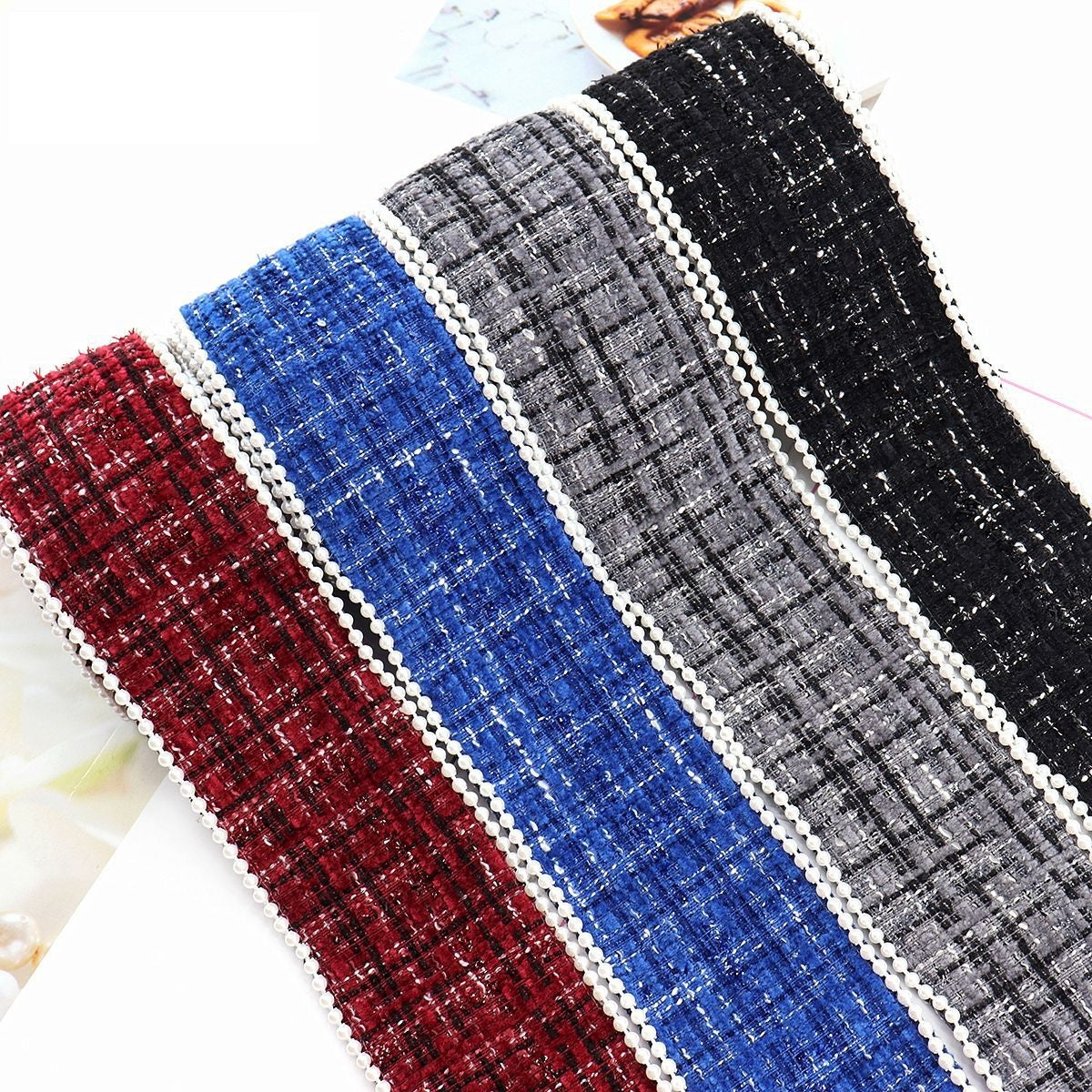 Checkered flannel ribbon in red, blue, gray, and black with white pearl bead trim