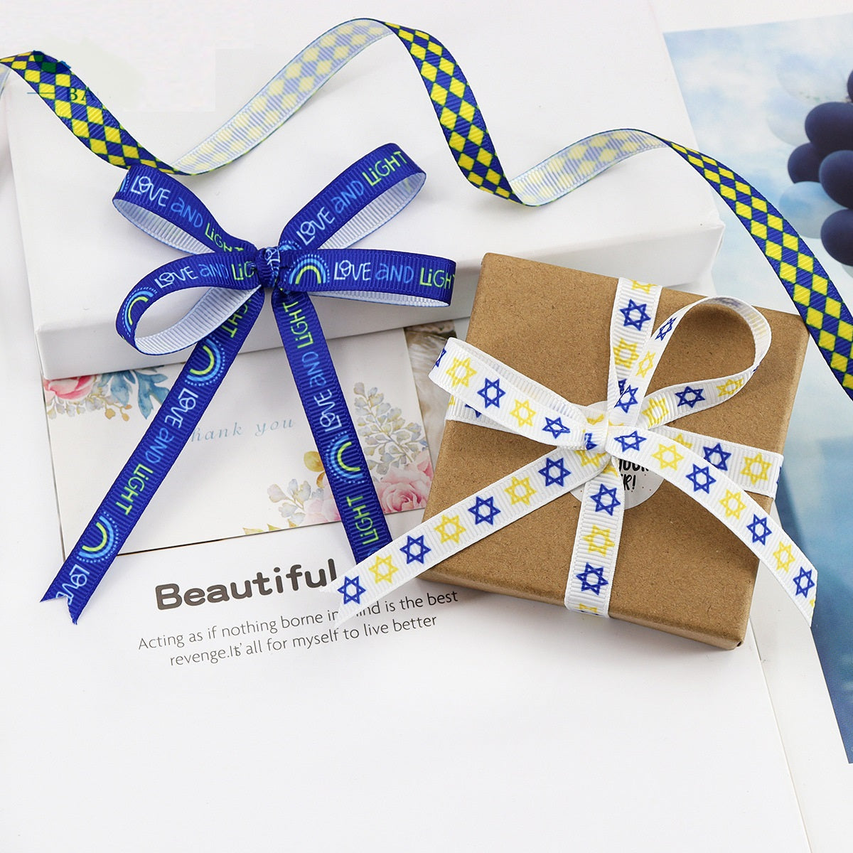 Hanukkah ribbon set with David-star prints and menorah graphics on gift box