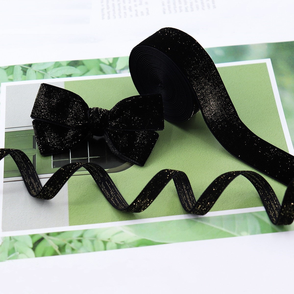 Black velvet ribbon with gold edge, bow with curled tails