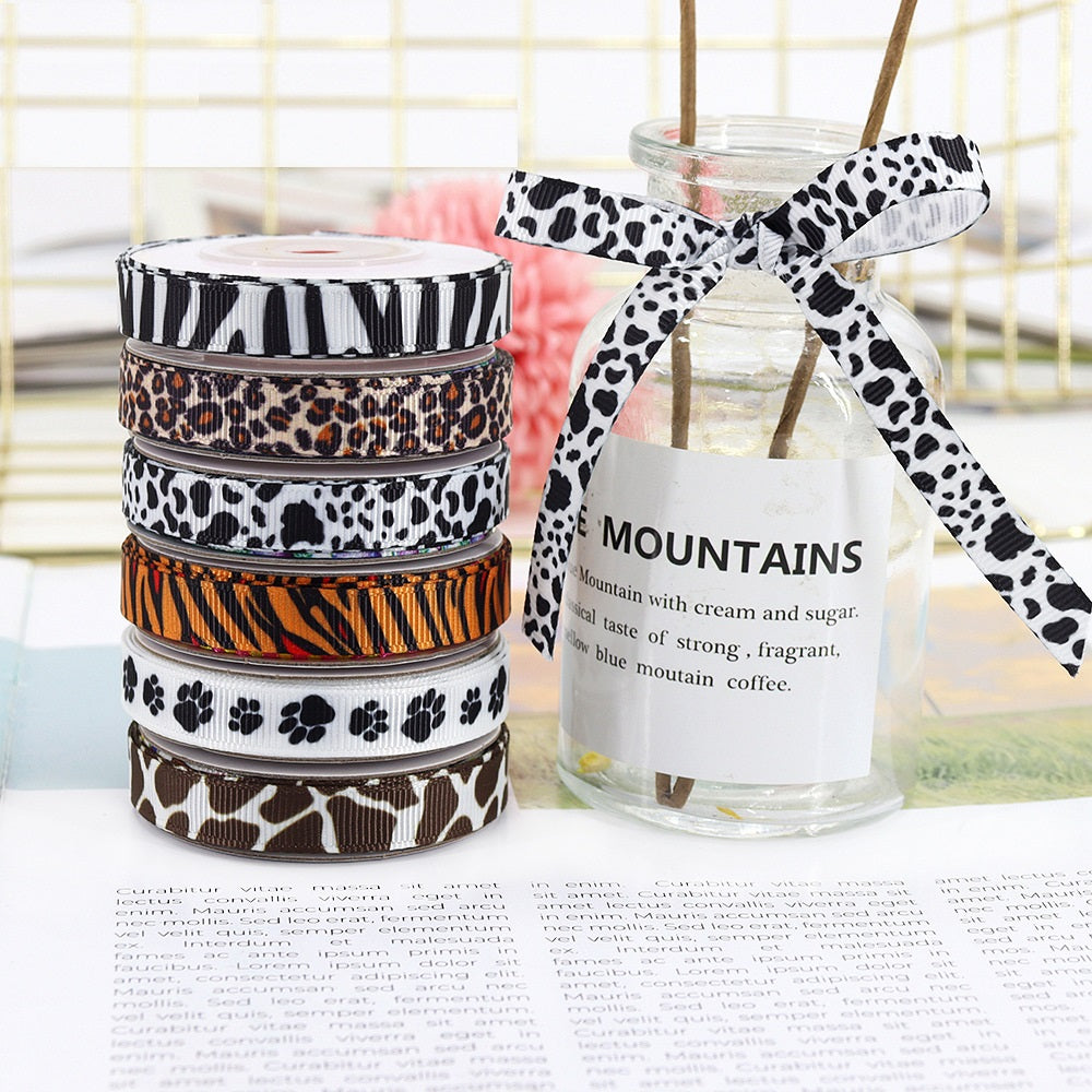 Animal print ribbon bow on a jar tag, black spots on white