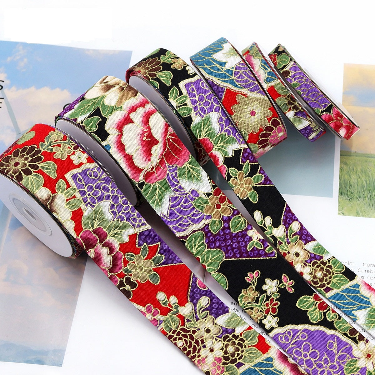 Japanese-style gold-foil ribbon rolls with floral pattern, black base and purple accents