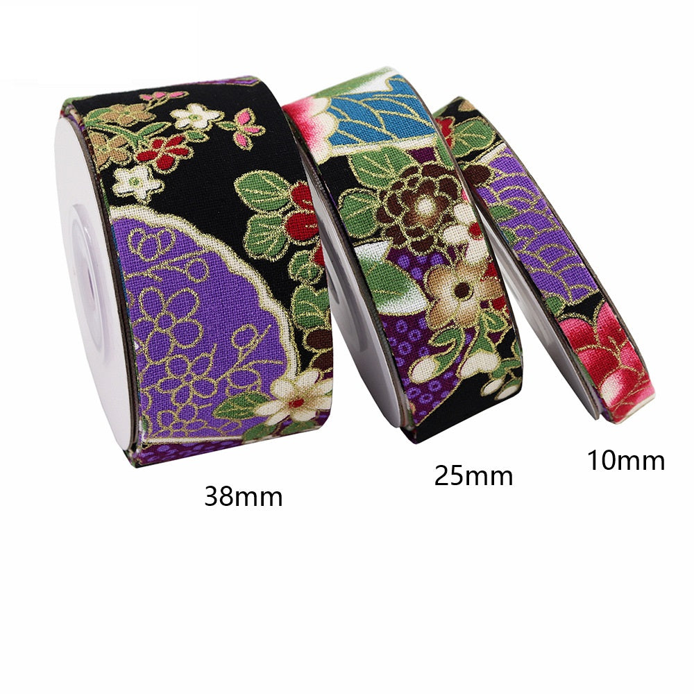 Ribbon set with gold-foil floral print showing widths: 38mm, 25mm, 10mm