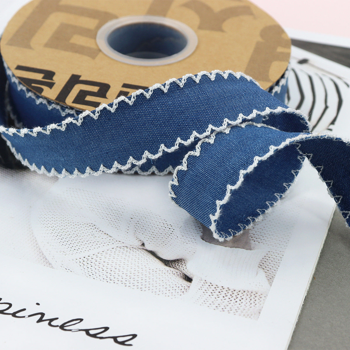 1.5-inch dark denim lace-edged ribbon with white scalloped stitched edge