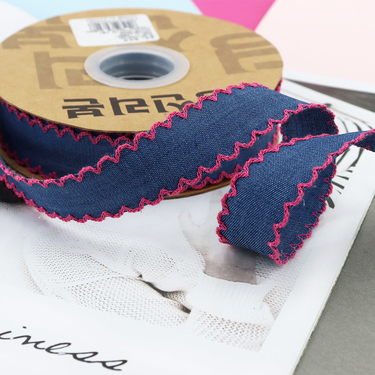 1.5-inch dark denim lace-edged ribbon with hot pink stitched zigzag trim