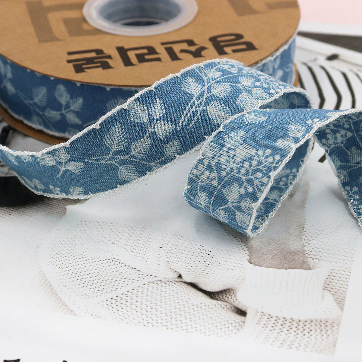Light blue denim ribbon with white lace edge and floral print, 1.5 inch wide