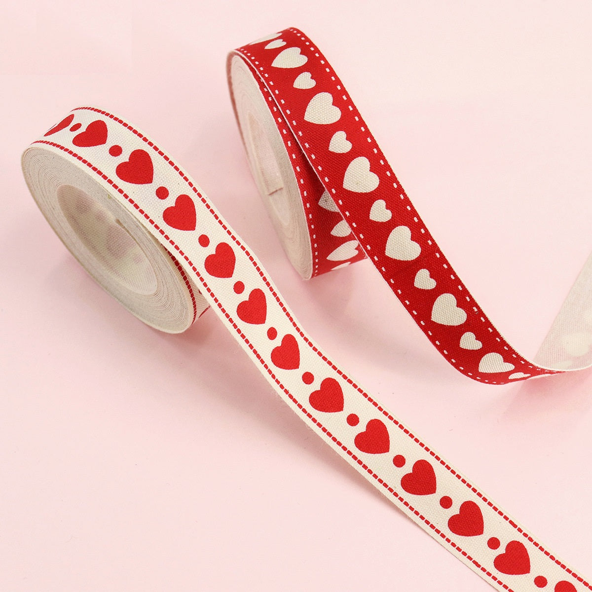 16mm cotton heart ribbon in red and cream with stitched dotted border