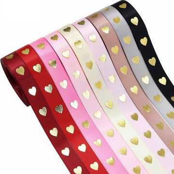 Heart hot-stamping ribbon roll: gold hearts on striped red/pink/cream/black