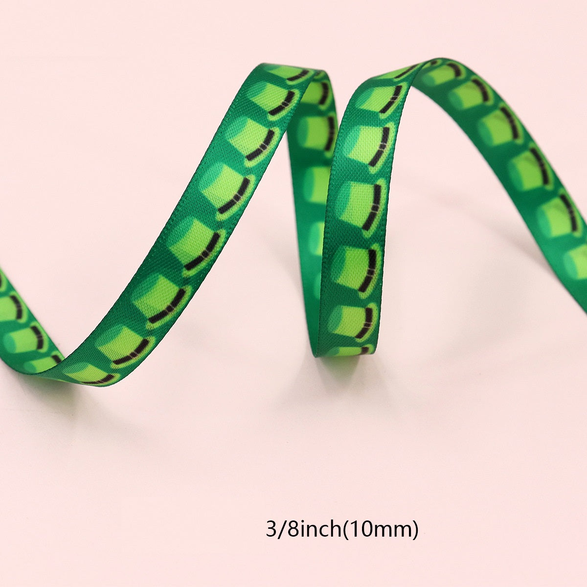 Green ribbon length, 10mm (3/8 in) wide, repeating clover design