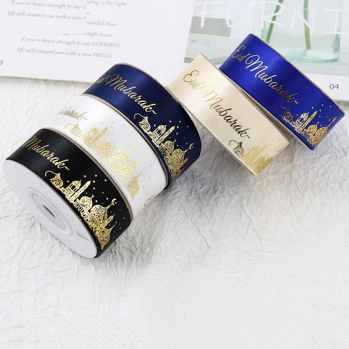 1-inch ribbon rolls set: black, cream, and navy blue bands with gold Eid Mubarak motifs