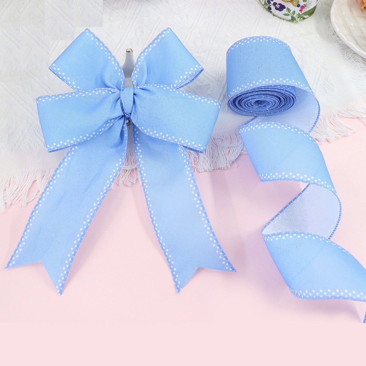 Blue wired-edge ribbon roll with matching bow, 2.5 in wide
