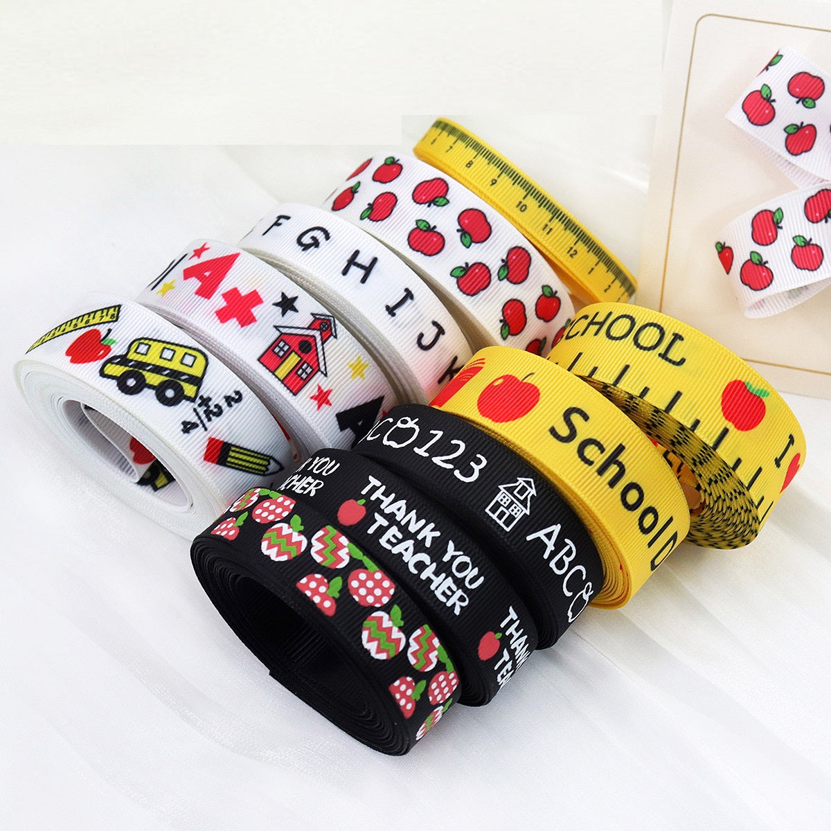 School ribbon rolls: white ABC, yellow ruler, black “Thank you Teacher”
