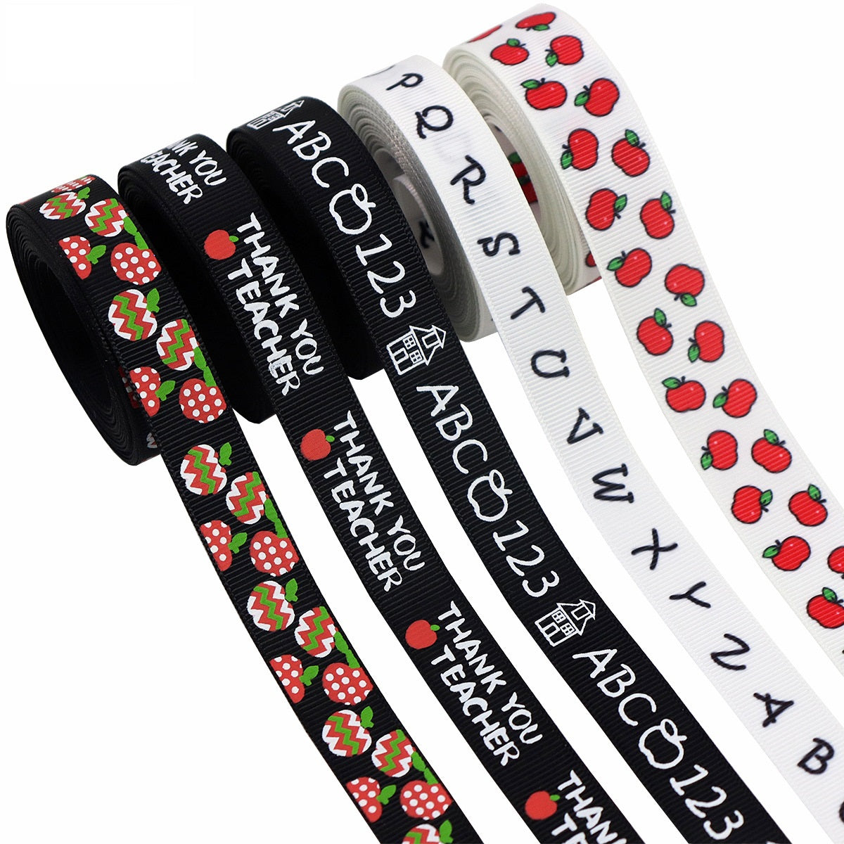 Rolled school ribbons: black “Thank you Teacher”, white ABC numbers, white apple print