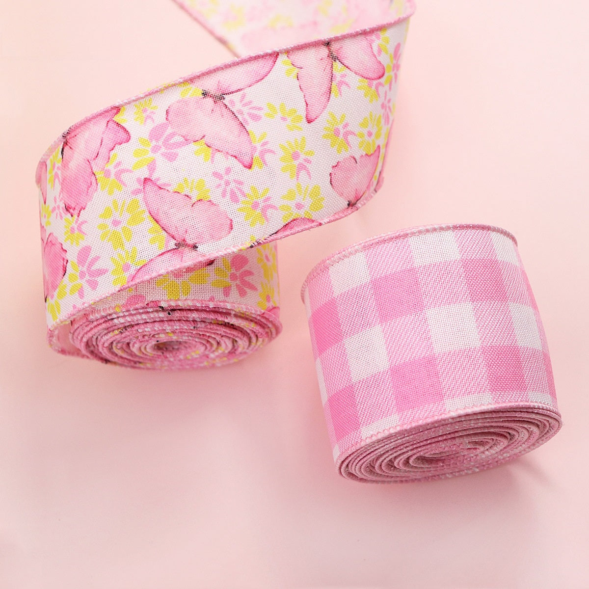 Close-up: pink butterfly floral wire-edge ribbon roll and pink gingham roll, 2-pack