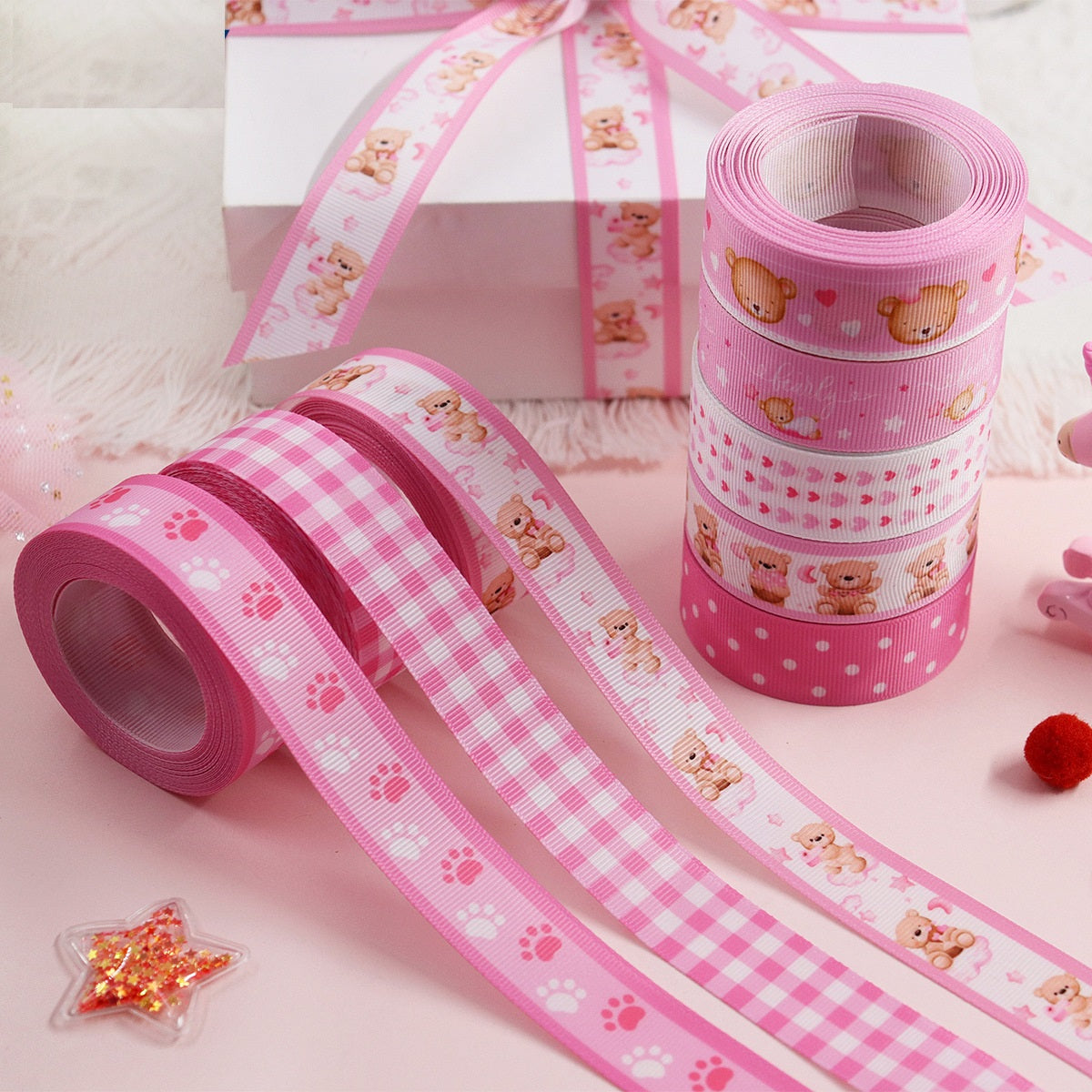 Pink 22mm ribbed ribbon rolls with bear paw prints and striped ribbon strips