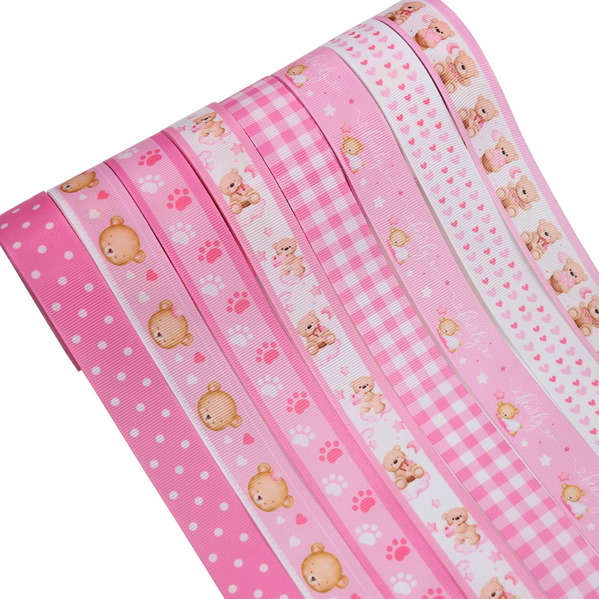 Pink 22mm ribbed ribbon set with assorted bear and paw designs, stacked rolls