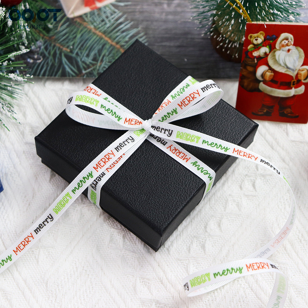 Merry Christmas ribbon tied on a black gift box; “MERRY” text in green with trees and icons