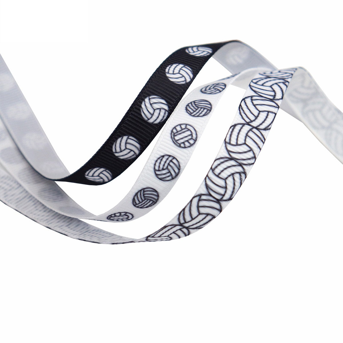 Black-and-white ribbed volleyball ribbon close-up with printed volleyball motifs