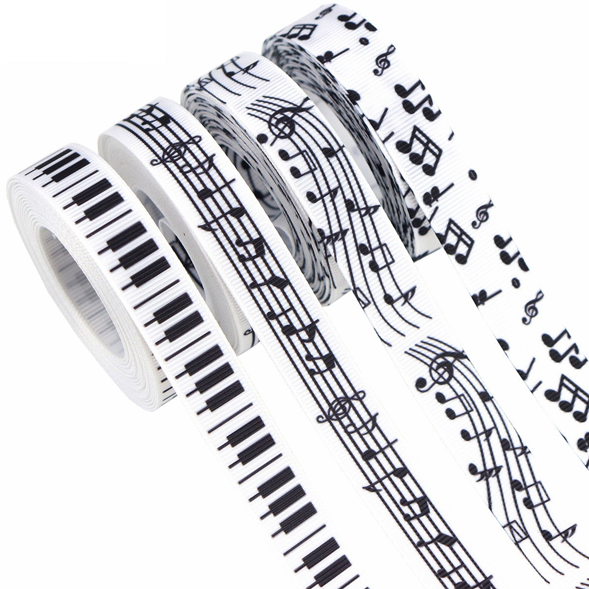 Rolled black-and-white ribbon with musical notes and staff lines, 16 mm wide