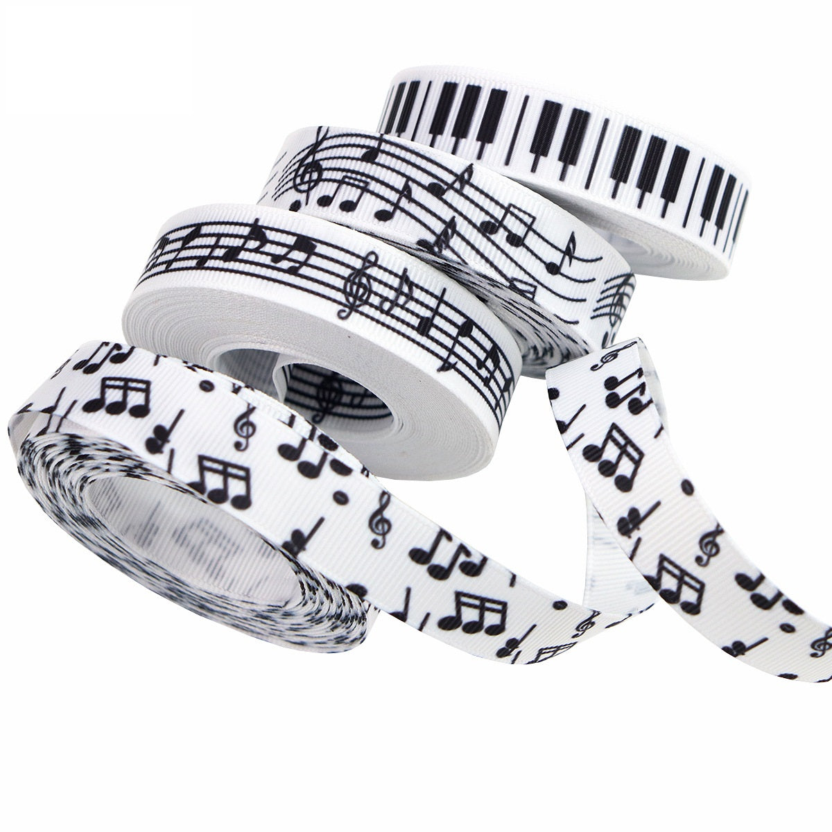 Black-and-white music note ribbon spool with piano keys and musical notes print