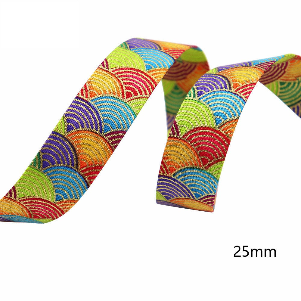 Sakura water ripple ribbon, 25mm width; rainbow wave arcs on multicolor fabric.