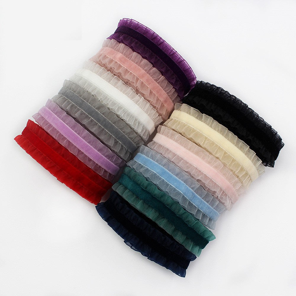 Colorful lace-edge elastic ribbon roll, assorted bright colors on ruffled strips