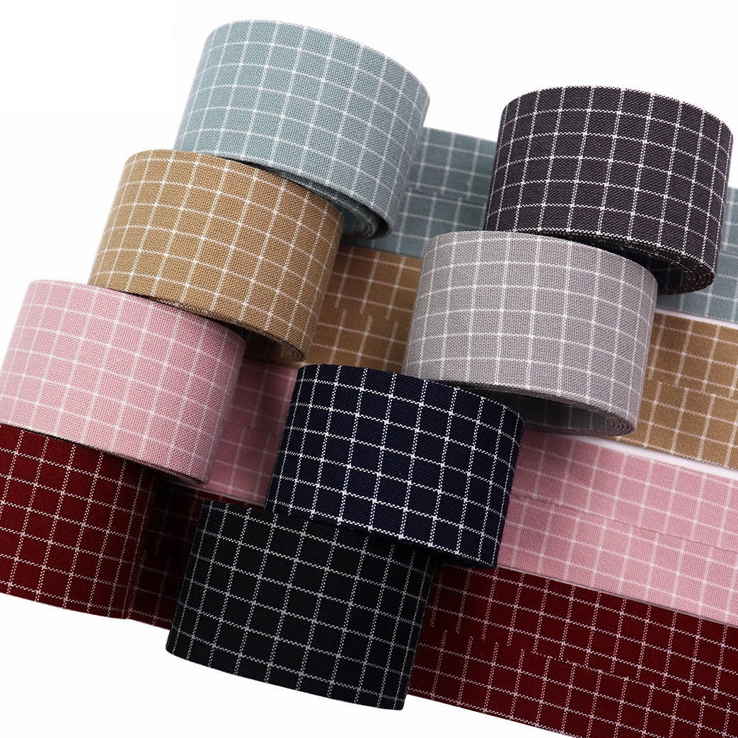 Assorted plaid cotton square patch ribbon rolls in pink, tan, blue, and gray