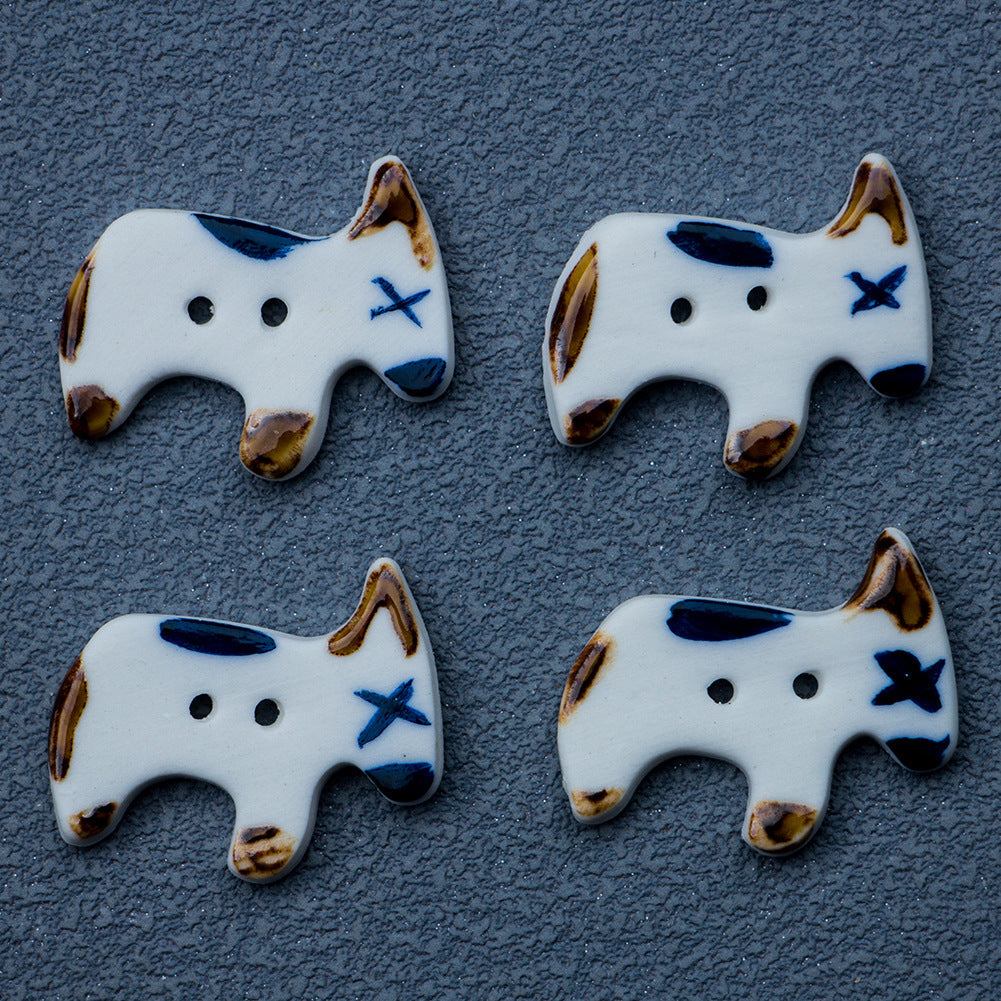 Set of 4 handmade ceramic puppy dog buttons, white with blue face and star marks, 2 holes