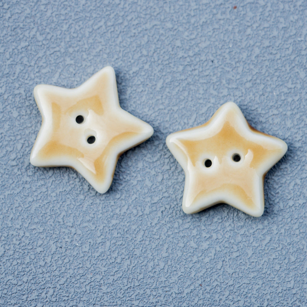 Cream ceramic star button with two holes, cute animal-style face design