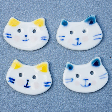 Hand-painted ceramic cat buttons, white base with yellow ears and 2 holes