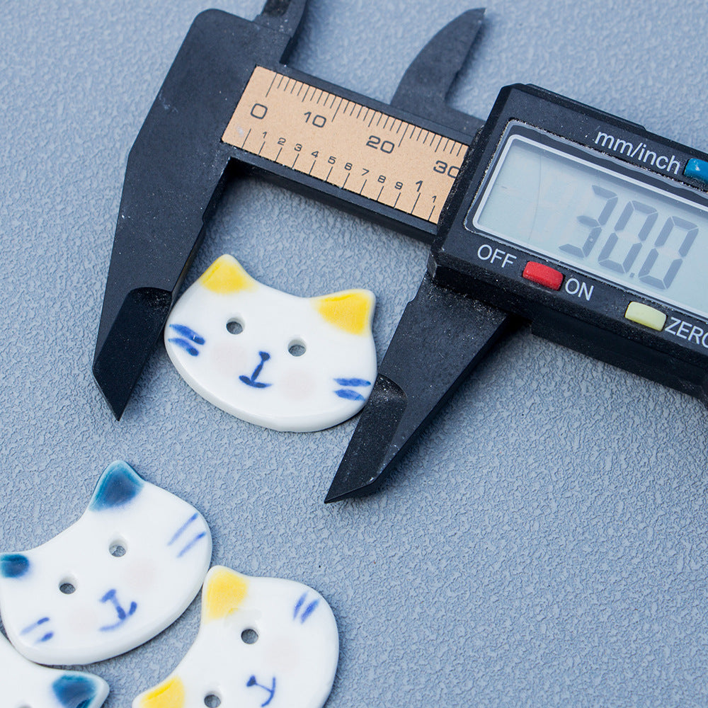 Blue-and-white hand-painted cat ceramic button, 2-hole design