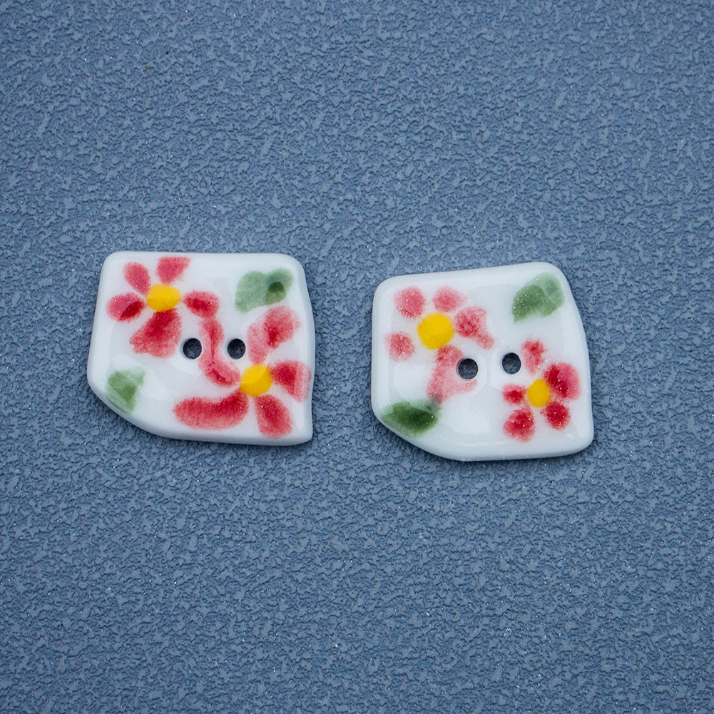 Trapezoidal ceramic buttons with pink flowers, yellow centers, green leaves, 2 holes